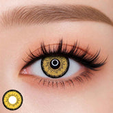 EOS dolly eye Brown colored contact lens worn on eye — bold yellow brown tone, FDA 510(k) cleared