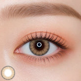 EOS Luna Natural Cacao colored contact lens worn on eye — natural brown tone, FDA 510(k) cleared