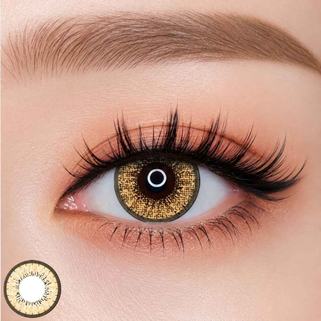 EOS New Adult Brown colored contact lens worn on eye —vivid yellow tone, FDA 510(k) cleared
