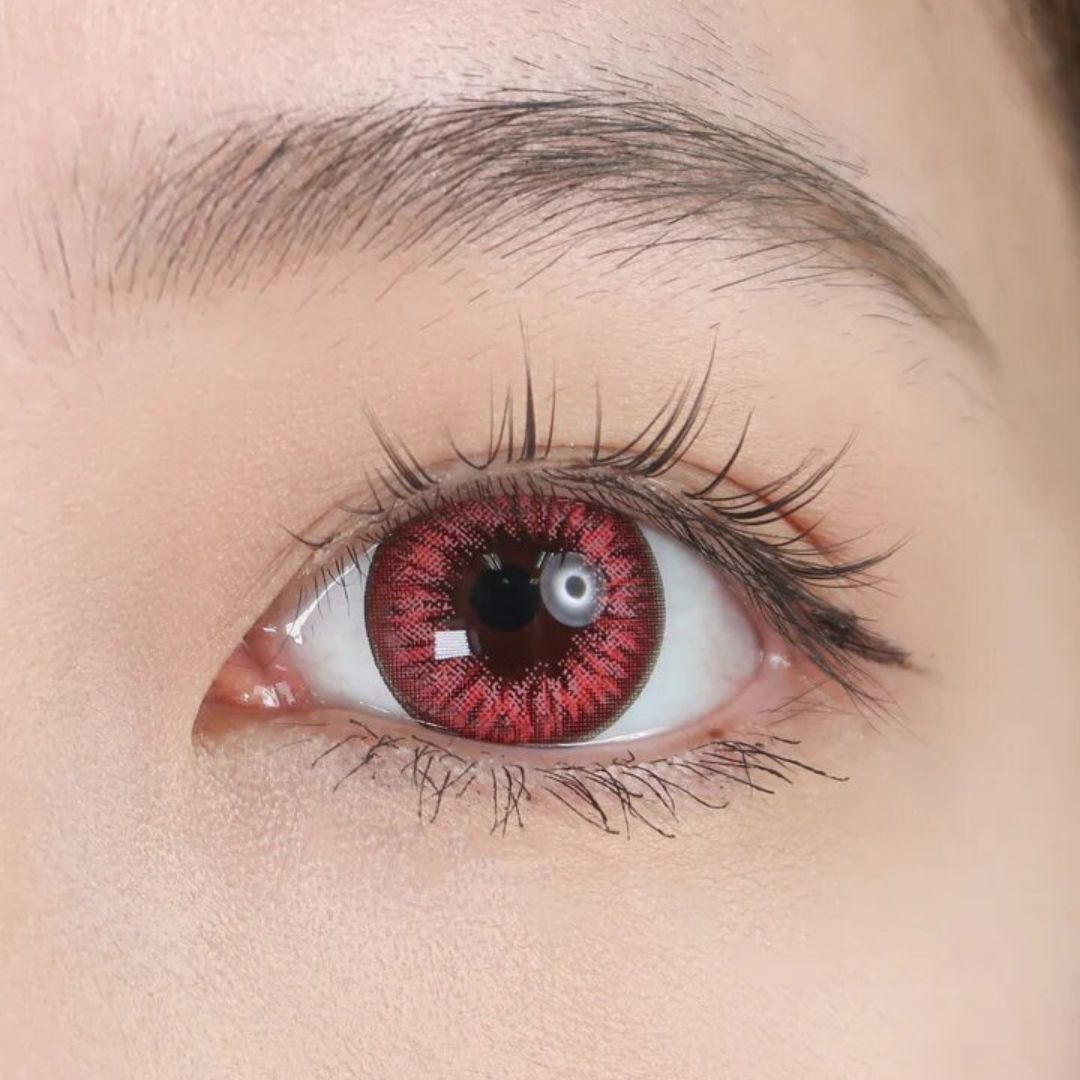 kazzue premier pinkish red colored contact lens closeup